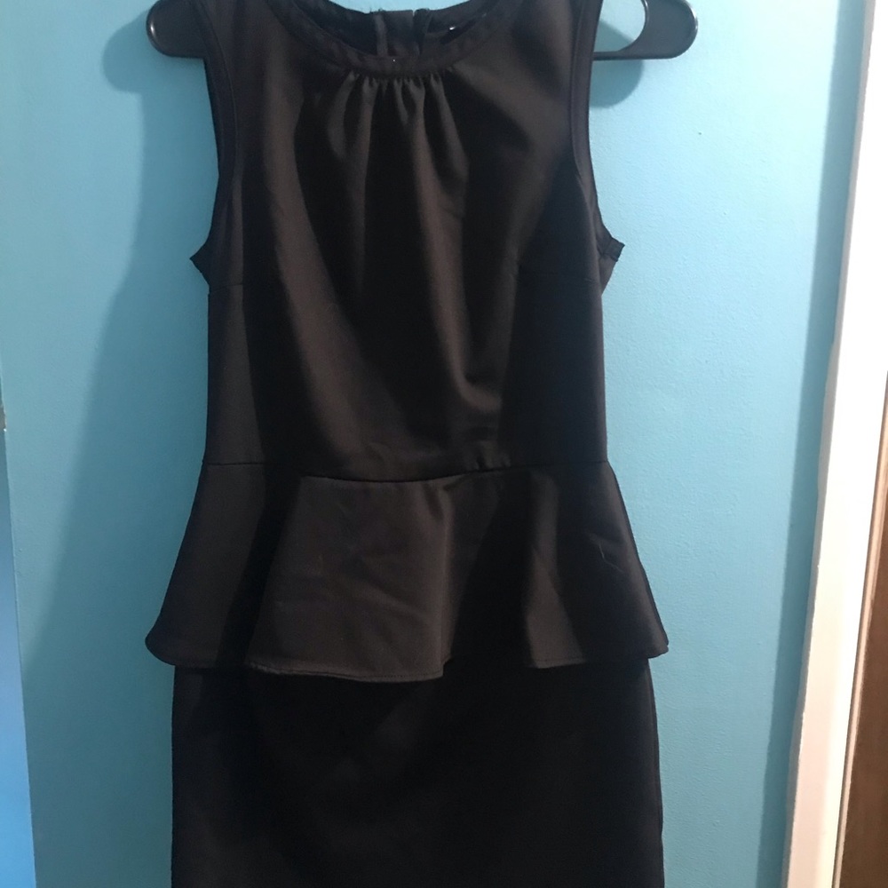 Short black dress with ruffle. Cute for an outside party or date night.